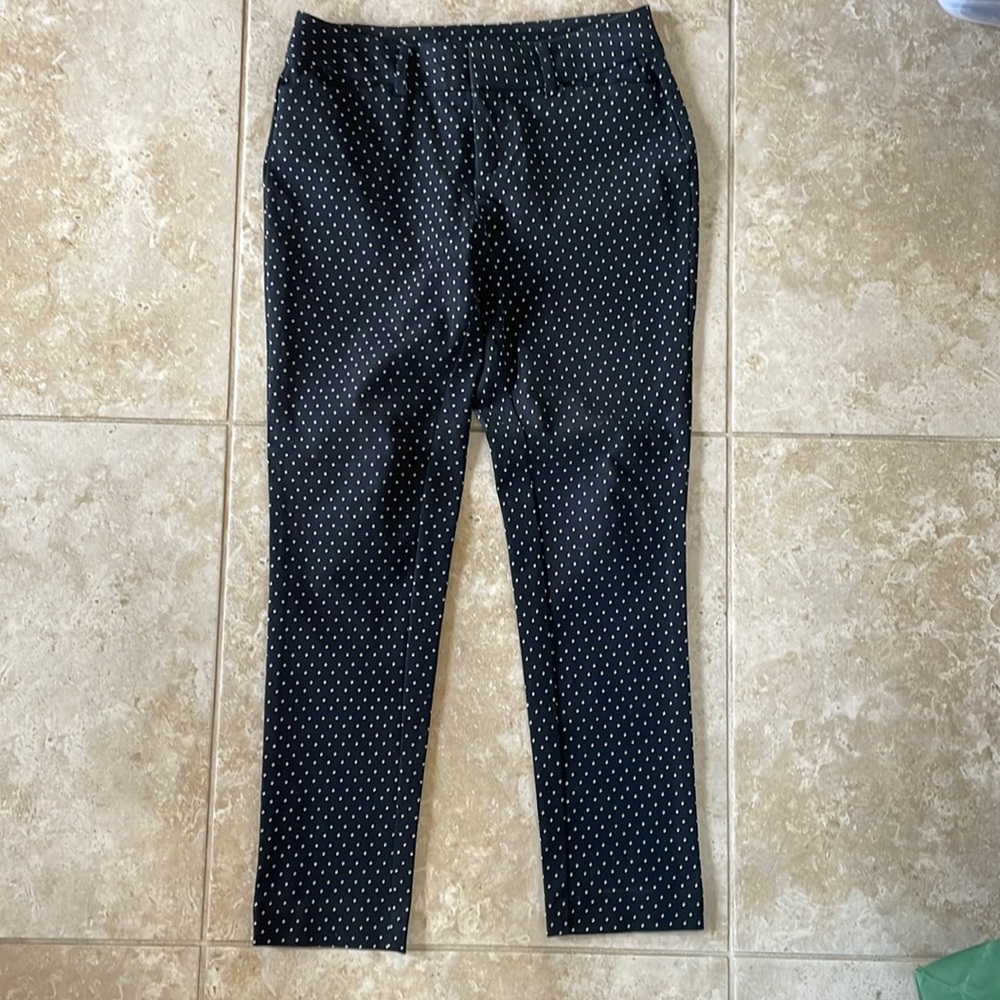 Black pants with tiny white accents